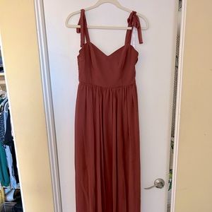 Davids Bridal Studio bridesmaid dress in pre loved condition in a rust color.